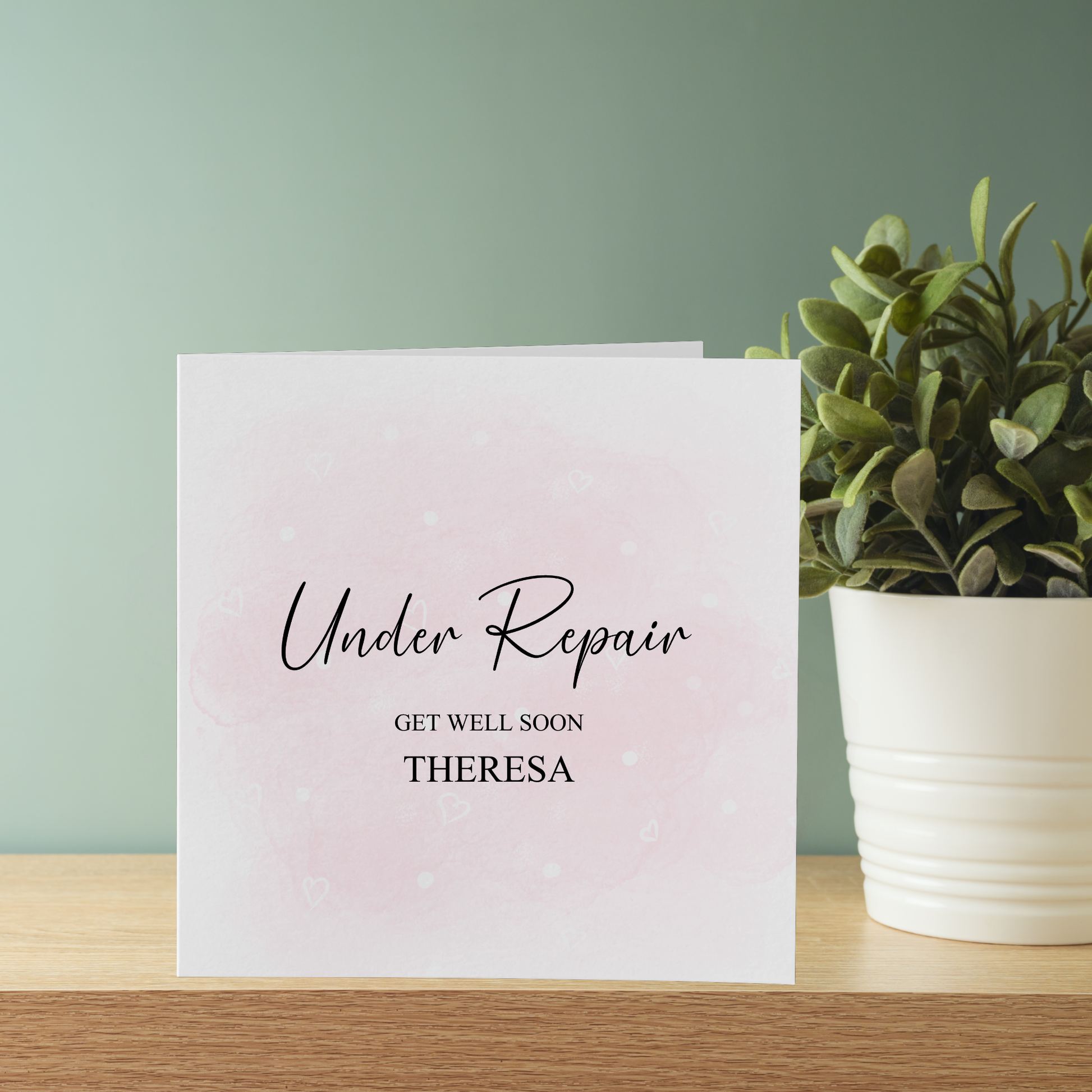 a card that reads under repair get well soon theresa
