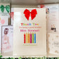 a bunch of greeting cards are on a shelf