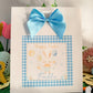 a happy easter card with a blue bow