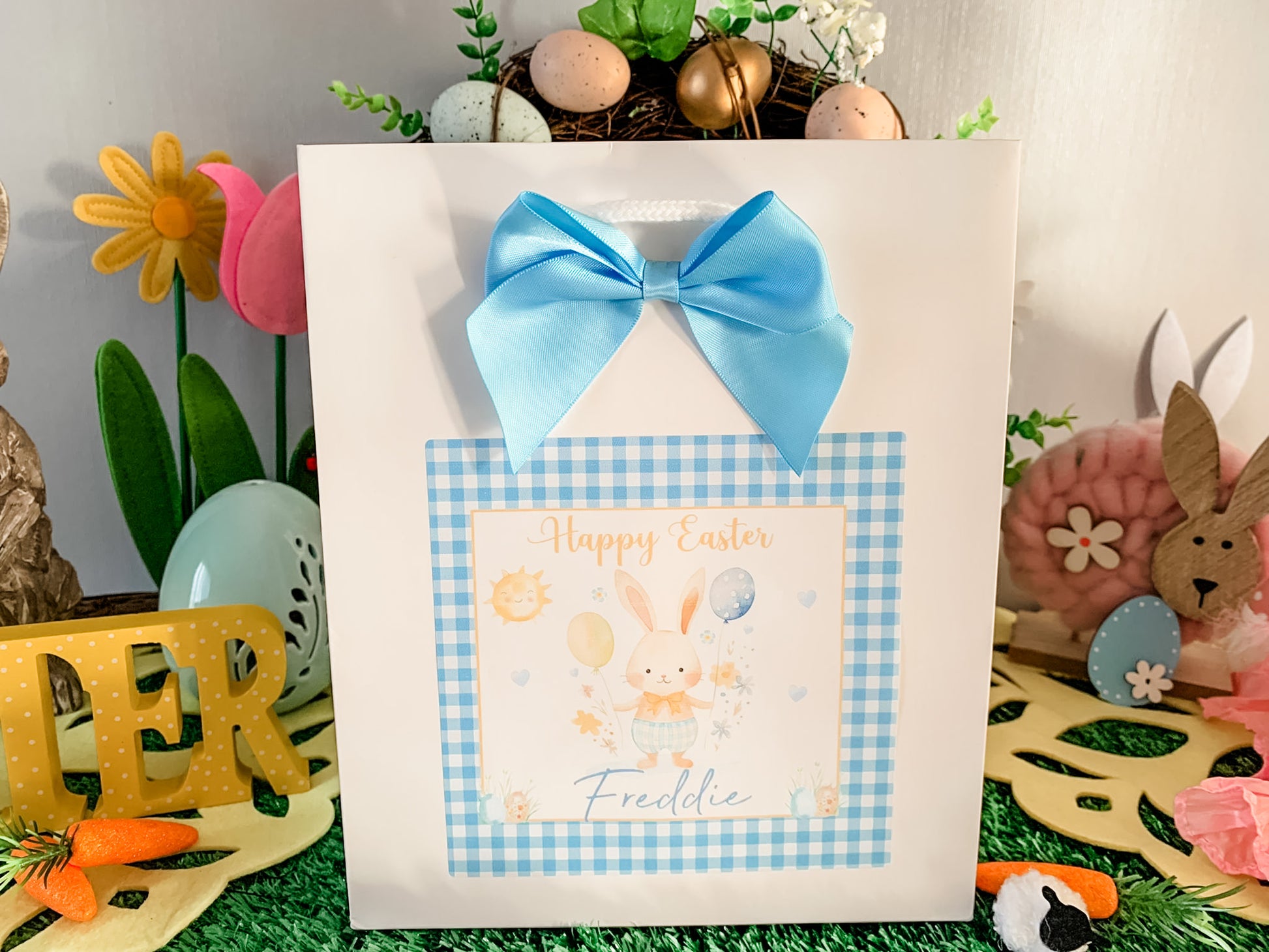 a greeting card with a blue bow on it