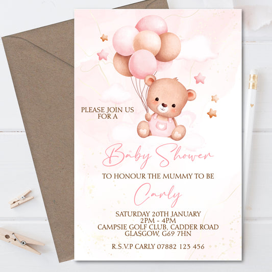 a baby shower card with a teddy bear holding balloons