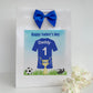 a father's day card with a soccer jersey and a blue bow