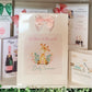 a card with a giraffe and a bow on it