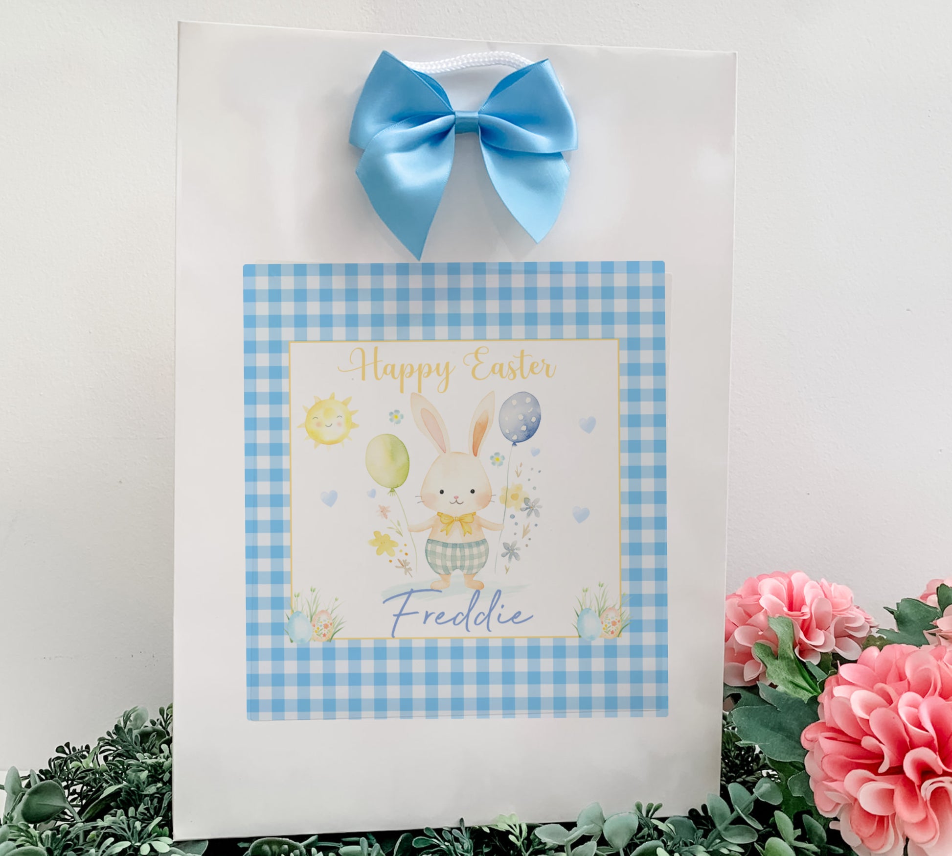 a picture of a happy easter card with a blue bow