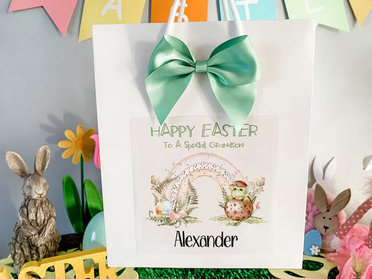 a happy easter card with a green bow