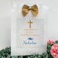 a white bag with a gold bow on top of it
