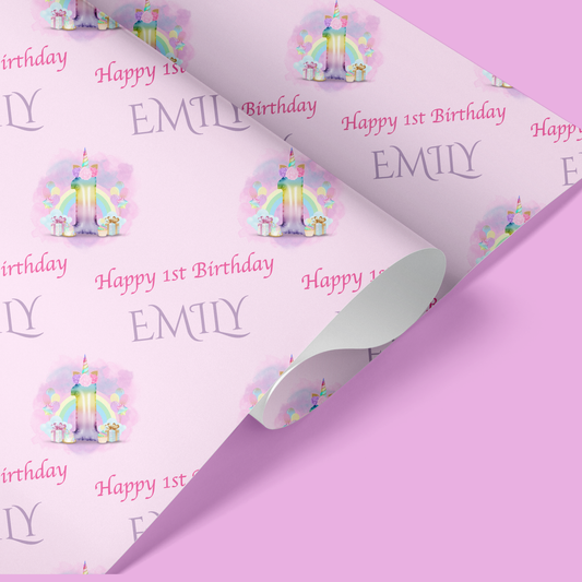 a pink birthday wrapping paper with a unicorn theme