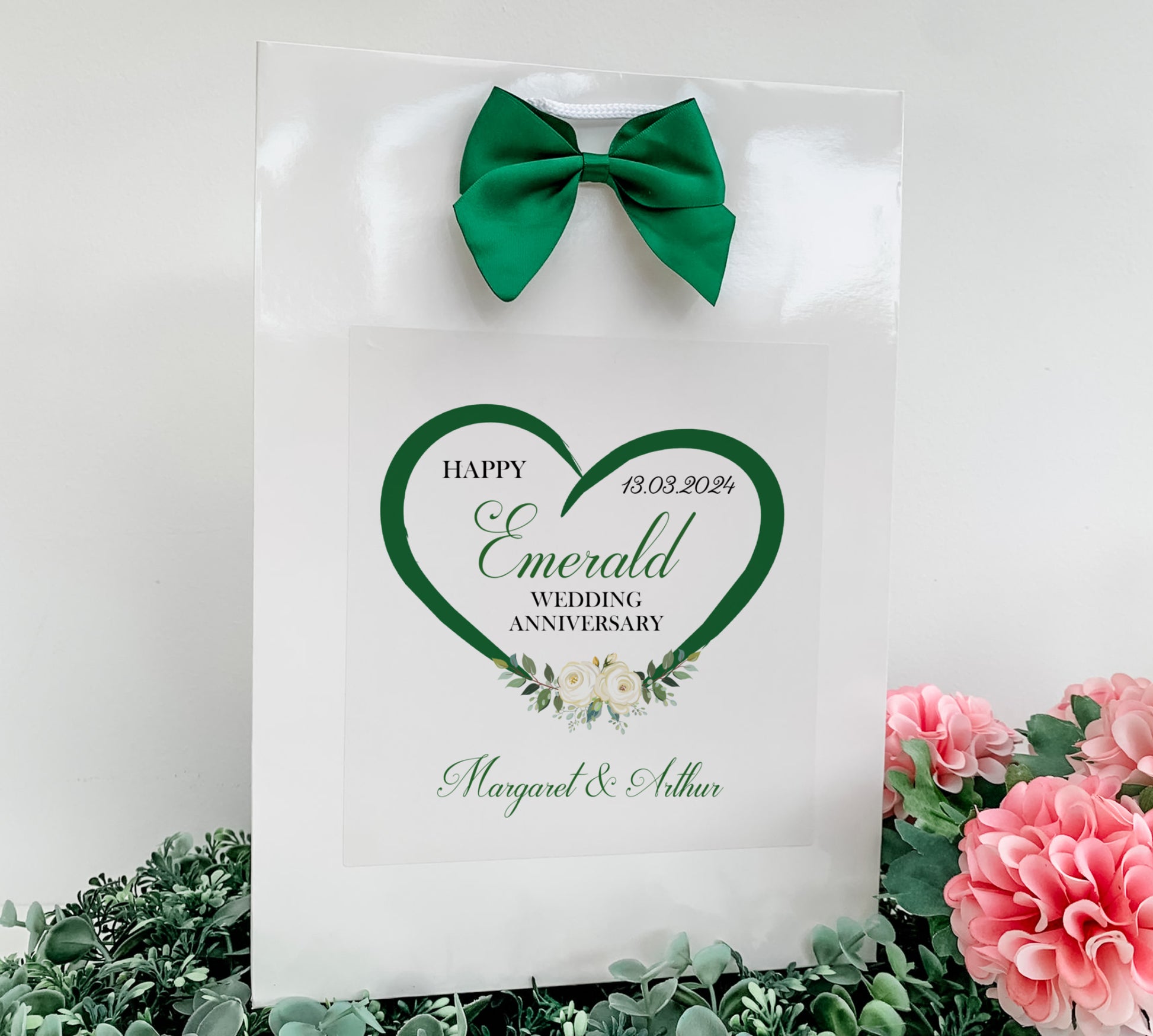 a white card with a green heart on it