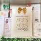 a couple of greeting cards are on a shelf