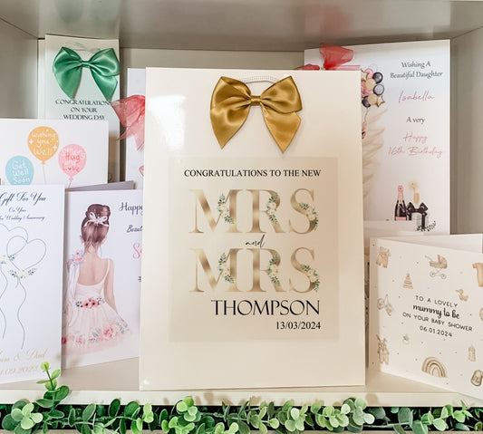 a couple of greeting cards are on a shelf