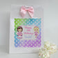 a birthday bag with a picture of two girls on it