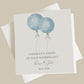 two blue balloons on a white card with the words congratulationss on your wedding day