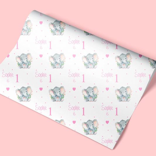 a pink wrapping paper with an elephant on it